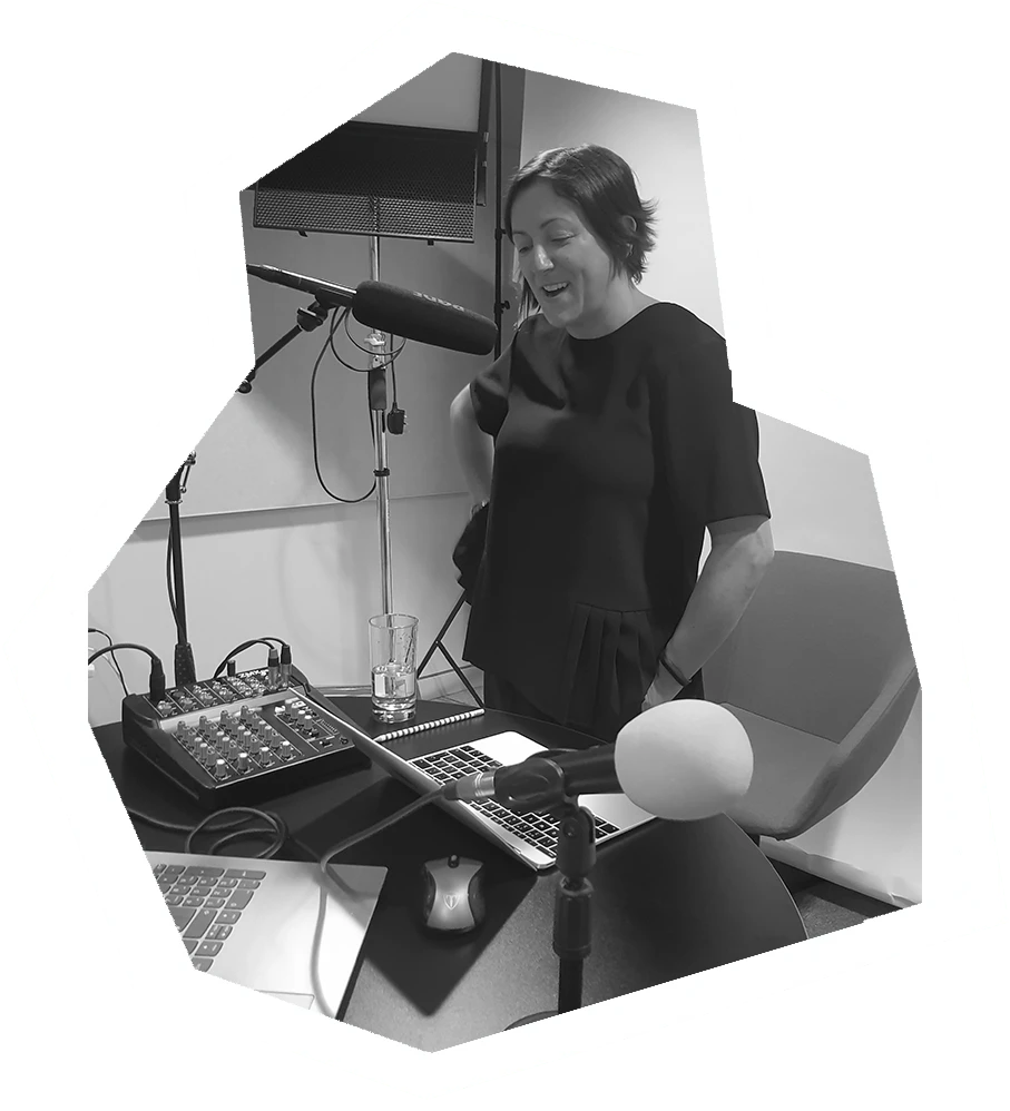 a woman speaks into a microphone