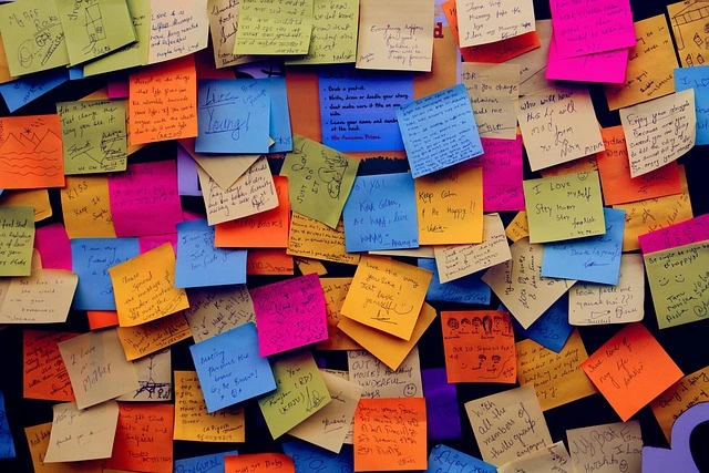 Colourful sticky notes covering a wall.